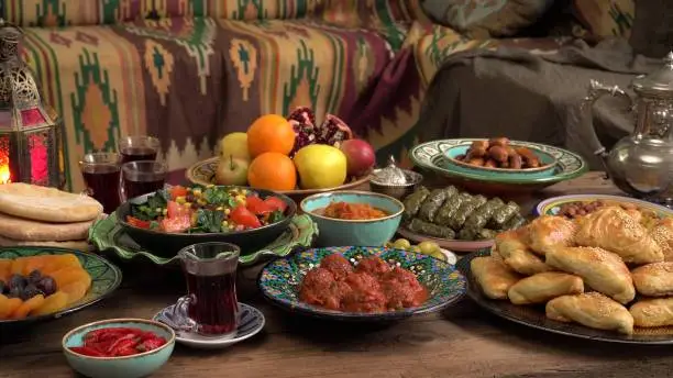 Festive traditional Middle Eastern Muslim Halal food on the table. Celebration of Eid al-Adha, Feast of Sacrifice
