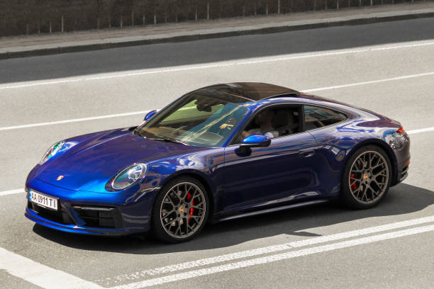 Blue supercar Porsche 911 Carrera S in the city stock photo