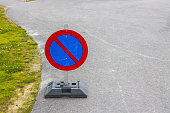 Close up view of temporary traffic sign on asphalt road. Sweden.