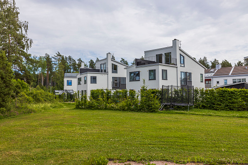 Beautiful landscape view of white modern village house. Sweden.
