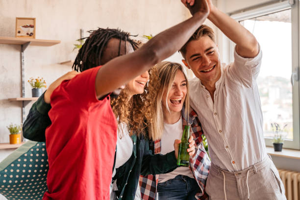 istock Excited fans cheering for sport team watching game 1326318139