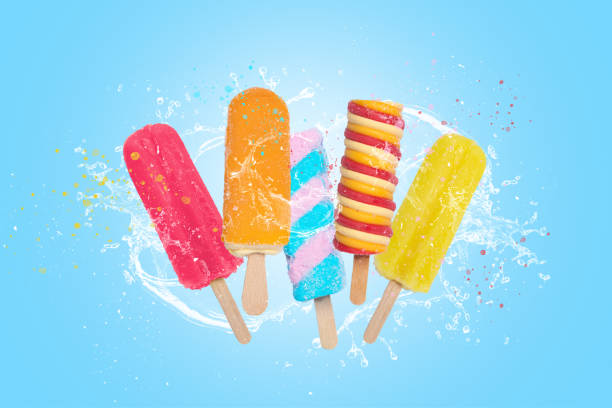 colorful popsicles ice cream on blue background with splash. - frozen sweet food imagens e fotografias de stock