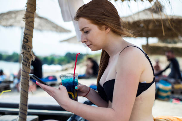 istock Redhead woman on the beach 1326319423