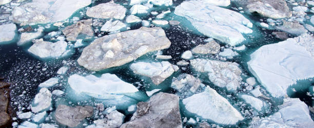 istock Global Warming and Climate Change - Icebergs from melting glacier in icefjord 1326320140