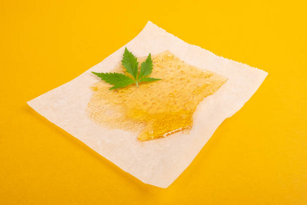 marijuana resin concentrate, yellow amber color cannabis wax stock photo