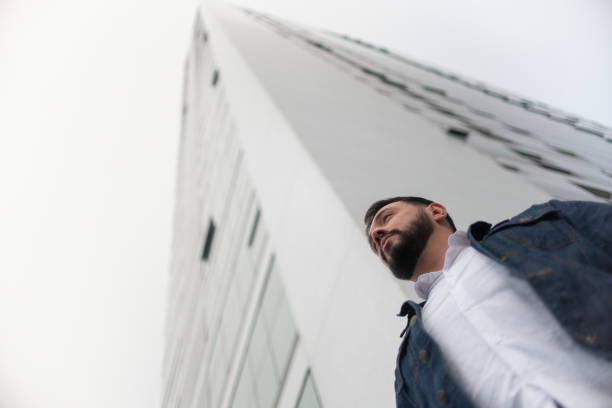 istock Man with building in the background 1326320819