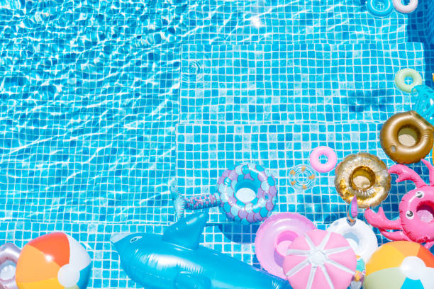 istock various inflatable on a pool water background. ball, crab, dolphin, float. summer and travel concept. copy space 1326322922