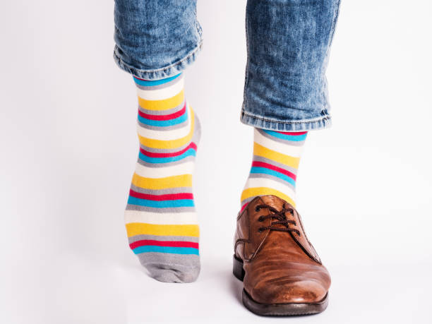 istock Men's legs, trendy shoes and bright socks 1326325043