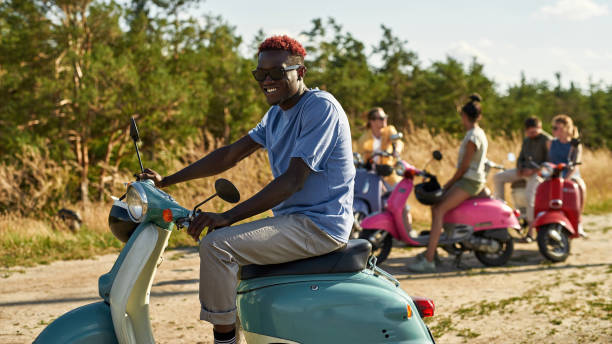istock Happy young african american boy resting on retro scooter 1326325291