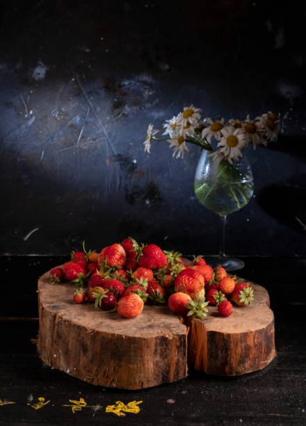 Bouquet from a camomile and wild strawberry stock photo