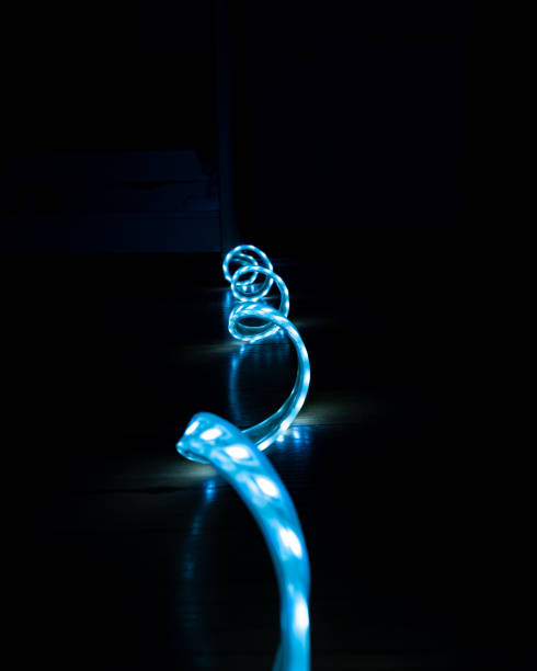 istock blue glowing LED strip with cold light on a black background close-up, decorative lighting 1326326469