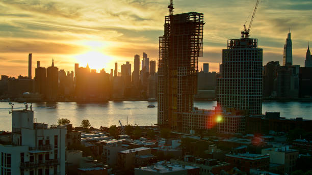 istock Sun Setting Behind Manhattan Skyline from Over Greenpoint, Brooklyn 1326326858