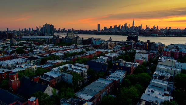 istock Drone Shot Looking Across Rooftops in Greenpoint, Brooklyn at Sunset 1326326940