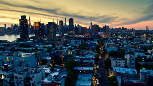 istock Rooftops in Brooklyn with New Towers Along Riverfront - Aerial View 1326326980