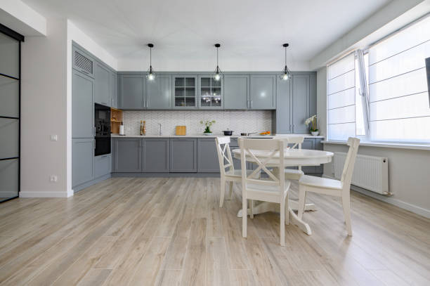 istock Trendy grey and white modern kitchen furniture in studio apartment 1326327630