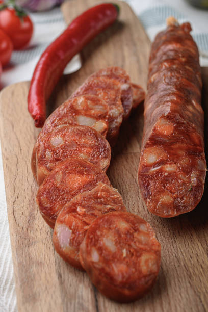 istock Traditional chorizo cuts with spices and ingredients on white surface 1326330781