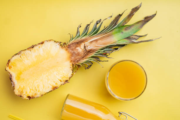 istock Pineapple cocktail or juice, on yellow textured summer background, top view flat lay 1326331458