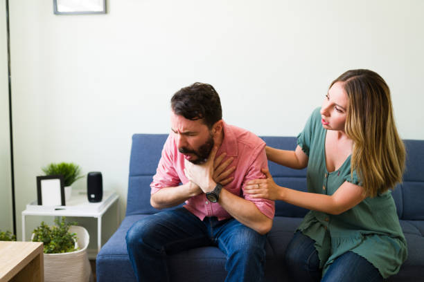 istock Man suffocating and with trouble breathing 1326331812
