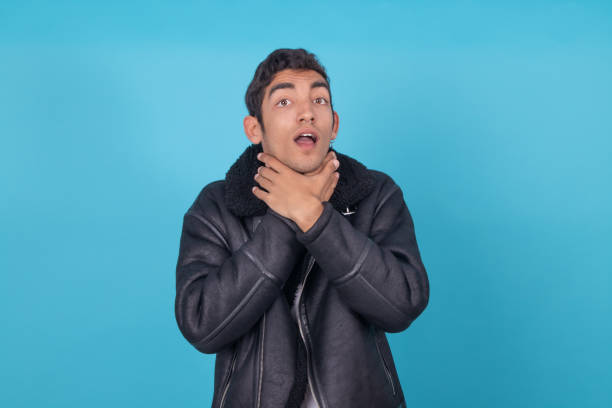 istock fashionable young man isolated on color background 1326332996