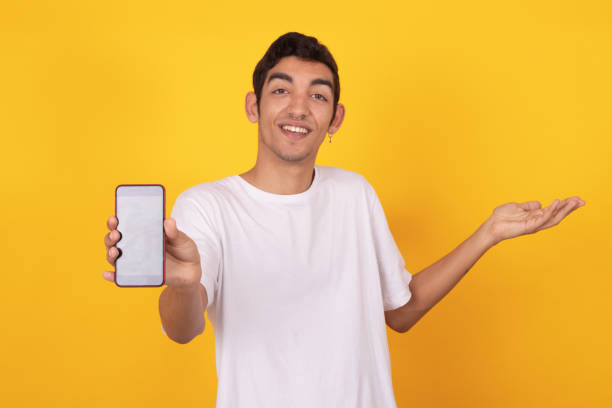 istock young teenager with mobile phone isolated on background 1326333205