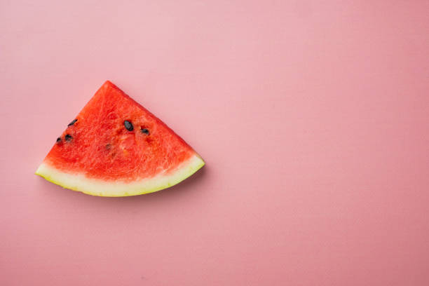 istock A half of fresh watermelon, on pink textured summer background, top view flat lay, with copy space for text 1326334034
