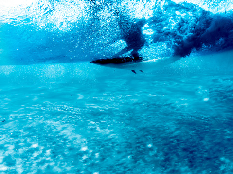 A surfer, underwater shot