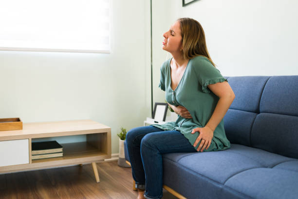 istock Stressed woman suffering from cramps 1326337245