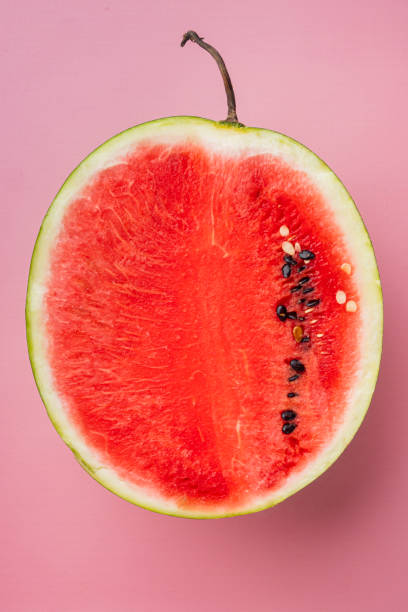 istock A half of fresh watermelon, on pink textured summer background, top view flat lay 1326337407