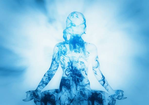 Silhouette of a woman meditating