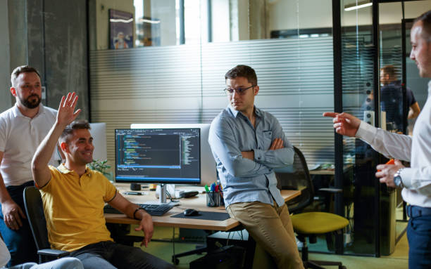 istock Young worker is asking questions about project his team leader. 1326339655