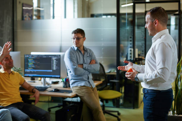 istock Team leader is informing his colleague about project. 1326339666