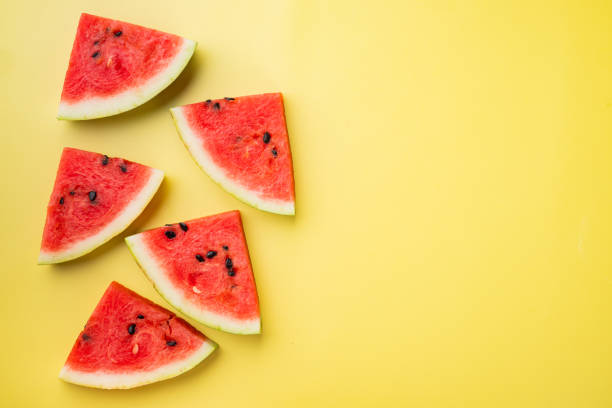 istock Fresh cut watermelon, on yellow textured summer background, top view flat lay, with copy space for text 1326340764
