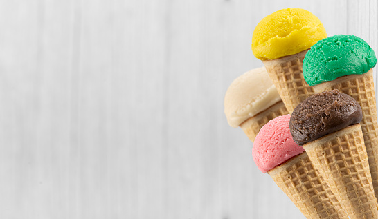 Tasty ice cream cones with different flavors.