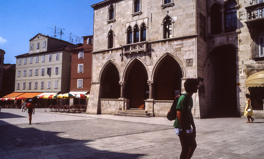 Split, Croatia, ex Yugoslavia - aug 1985: in Pjaca Square restaurants and bar tables, among the alleys that wind through the remains of Diocletian's Palace.