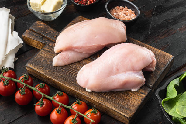 chicken kiev ingredients with filo, on old dark  wooden table background - chicken breast imagens e fotografias de stock