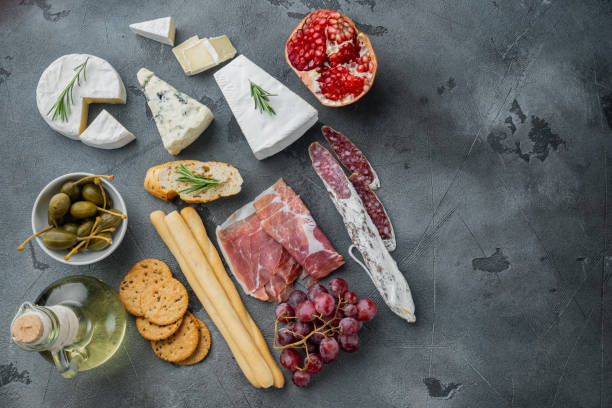 istock Appetizers table with differents antipasti, on gray background, flat lay  with copy space for text 1326345388
