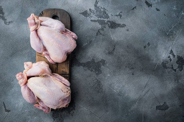 istock Raw organic uncooked whole chicken, on gray background, top view with copy space for text 1326345622