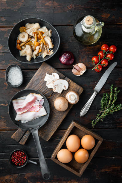 istock Breakfast egg ingredients, on old dark  wooden table background, top view flat lay 1326347341