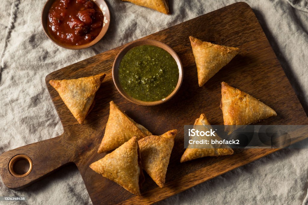 Homemade Indian Potato and Lentil Samosas Homemade Indian Potato and Lentil Samosas with Dipping Chutney Samosa Stock Photo Homemade Indian Potato and Lentil Samosas Homemade Indian Potato and Lentil Samosas with Dipping Chutney Samosa Stock Photo
