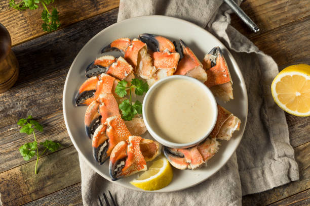 Homemade Steamed Stone Crab Claws Homemade Steamed Stone Crab Claws with Dipping Sauce crab leg photos stock pictures, royalty-free photos & images
