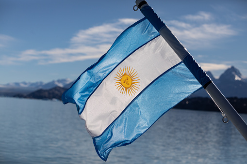 Argentinian flag flaming at Patagonia's landscape