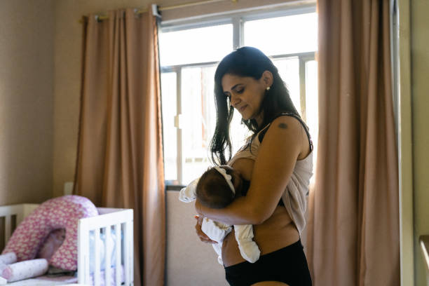 istock mother breastfeeding in the bedroom 1326349790