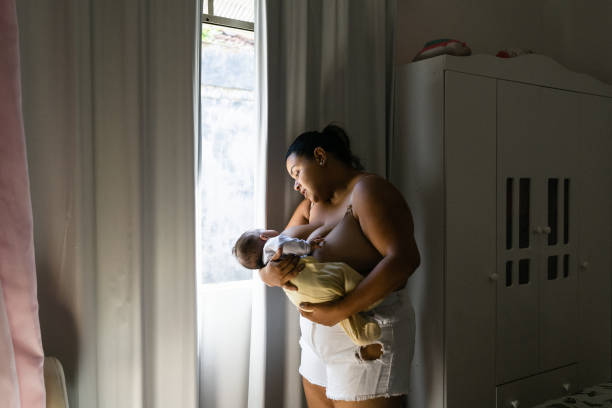 istock mother breastfeeding at the window 1326350601