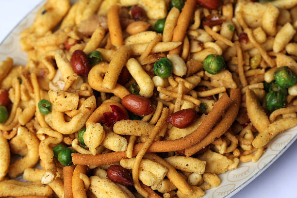 Isolated Fresh and Crunchy Nimco Mix, Delicious Blend of Sev, Peanuts, Chick Peas and Fried Lentil. Isolated Fresh and Crunchy Nimco Mix, Delicious Blend of Sev, Peanuts, Chick Peas and Fried Lentil. lahore pakistan photos stock pictures, royalty-free photos & images
