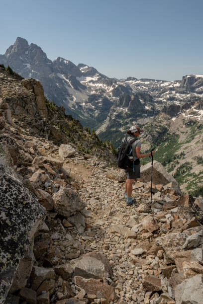 istock Hiker Looks Out From Paintbrush Divide 1326352477