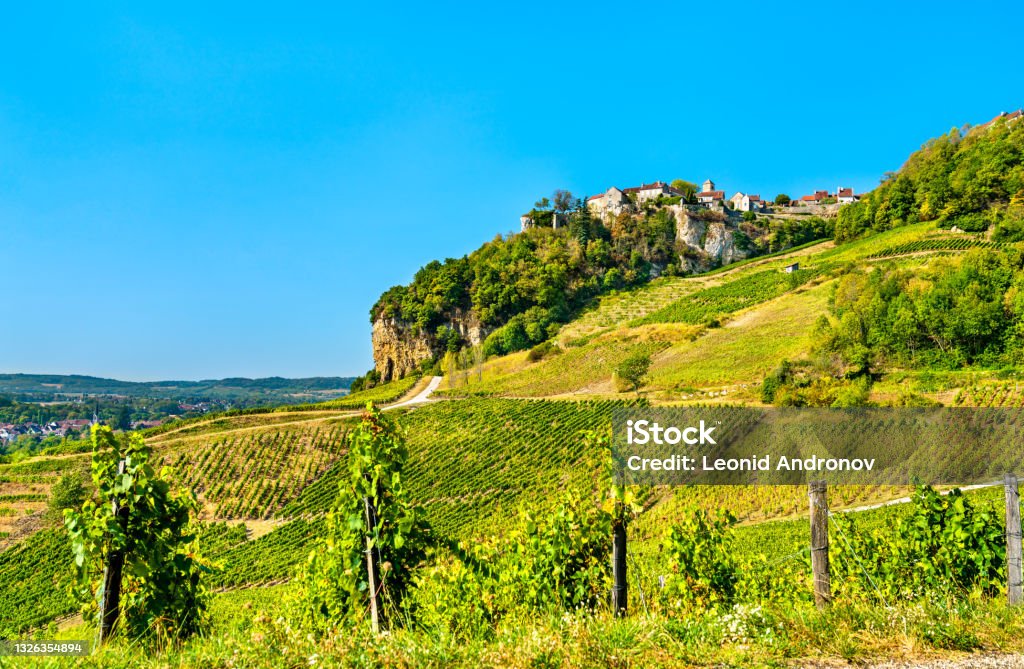 Chateau-Chalon village above its vineyards in Jura, France Chateau-Chalon village above its vineyards in Franche-Comte, France Jura - France Stock Photo