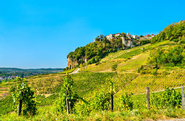 Chateau-Chalon village above its vineyards in Jura, France Chateau-Chalon village above its vineyards in Franche-Comte, France jura france stock pictures, royalty-free photos & images