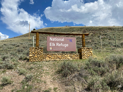 Jackson Hole, Wyoming - May 16, 2021: Sign for the National Elk Refuge located just outside Jackson Hole, Wyoming.