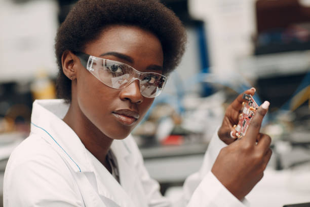 istock Scientist african american woman working in laboratory with electronic instruments 1326356994