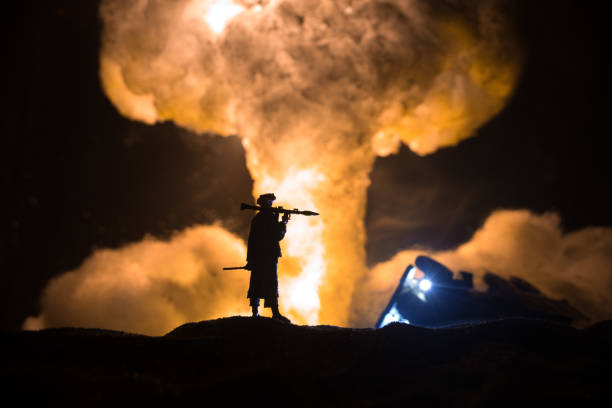 Military soldier silhouette with bazooka. War Concept. Military silhouettes fighting scene on war fog sky background, Soldier Silhouette aiming to the target at night. Military soldier silhouette with bazooka. War Concept. Military silhouettes fighting scene on war fog sky background, Soldier Silhouette aiming to the target at night. Attack scene hand grenade photos stock pictures, royalty-free photos & images